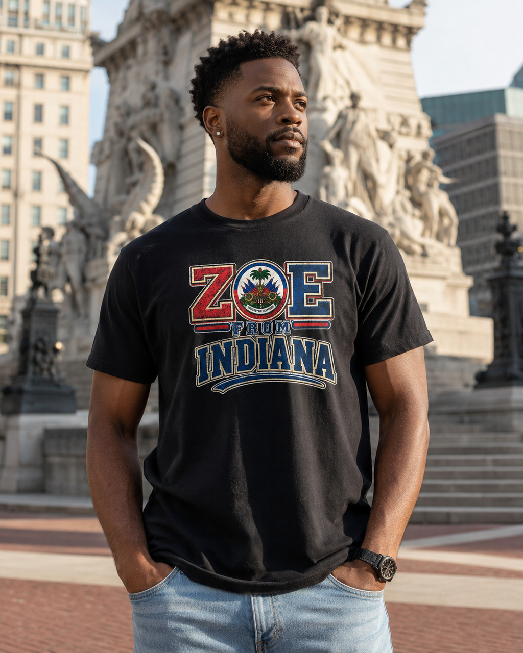 Male model wearing the black ZOE From Indiana T-shirt at Monument Circle in Indianapolis